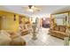 Comfortable living room featuring tile floors, ample seating, and an open layout perfect for entertaining guests at 316 Amanda Ln, Leesburg, FL 34748