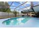 Inviting screened-in pool with a large deck, offering a perfect space for relaxation and recreation at 316 Amanda Ln, Leesburg, FL 34748