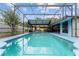 Inviting screened-in pool with a large deck, offering a perfect space for relaxation and recreation at 316 Amanda Ln, Leesburg, FL 34748