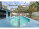 Inviting screened-in pool with a large deck, offering a perfect space for relaxation and recreation at 316 Amanda Ln, Leesburg, FL 34748