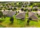 Aerial view showcases well-maintained homes with green lawns in a desirable neighborhood at 31924 Geoff, Sorrento, FL 32776
