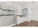 A clean bathroom with white subway tile, glass enclosed shower and a soaking tub at 31924 Geoff, Sorrento, FL 32776