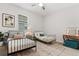 A bright bedroom showcasing two beds, decor, and a window providing ample light at 31924 Geoff, Sorrento, FL 32776
