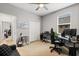 Bright bedroom featuring a ceiling fan, closet, and a large window for natural light at 31924 Geoff, Sorrento, FL 32776