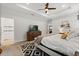 Bright bedroom featuring a tray ceiling and an ensuite bathroom with a walk-in shower at 31924 Geoff, Sorrento, FL 32776