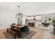 Open concept dining area with modern lighting fixtures and seamless flow to kitchen at 31924 Geoff, Sorrento, FL 32776