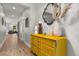 Inviting hallway featuring a stylish yellow dresser and modern decor accents at 31924 Geoff, Sorrento, FL 32776