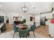 Open layout connecting kitchen, dining area, and living room with stylish decor and lighting fixtures at 31924 Geoff, Sorrento, FL 32776