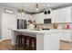 Bright kitchen with a large island and stylish pendant lighting. Modern appliances at 31924 Geoff, Sorrento, FL 32776