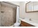 Bathroom showcasing a tiled shower and updated vanity at 3226 Midnight Star Ct, Kissimmee, FL 34744