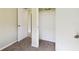Bedroom closet with white doors and carpet at 3226 Midnight Star Ct, Kissimmee, FL 34744