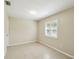 Clean and bright bedroom with tiled floor, neutral paint, and shuttered windows for natural light at 3226 Midnight Star Ct, Kissimmee, FL 34744