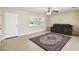 Bright living room with tiled floor and neutral paint, filled with natural light through large windows at 3226 Midnight Star Ct, Kissimmee, FL 34744