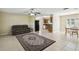 Inviting living room with tiled floor, a ceiling fan and an open floor plan at 3226 Midnight Star Ct, Kissimmee, FL 34744