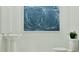 Simple half-bathroom with pedestal sink, modern toilet, and decorative painting at 349 Sol Vista Dr, Dundee, FL 33838