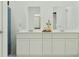 Modern bathroom with double sinks, ample countertop space, and minimalist fixtures at 349 Sol Vista Dr, Dundee, FL 33838