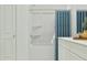 Clean bathroom with a white tub-shower combo, neutral walls, and modern fixtures at 349 Sol Vista Dr, Dundee, FL 33838