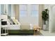 Sunlit bedroom featuring neutral decor, a cozy bed, and a calming green houseplant near the windows at 349 Sol Vista Dr, Dundee, FL 33838