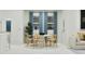 Bright dining area features a modern round table and blue window coverings at 349 Sol Vista Dr, Dundee, FL 33838