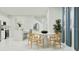 Open dining area offers a round table with seating adjacent to the kitchen at 349 Sol Vista Dr, Dundee, FL 33838