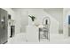 Modern kitchen features an island with bar seating and stainless appliances at 349 Sol Vista Dr, Dundee, FL 33838