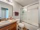 Bright bathroom featuring a large vanity with double sinks and a shower-tub combo at 3599 Caruso Pl, Oviedo, FL 32765