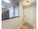 Inviting entryway featuring tiled floors, a white front door, and a view into the kitchen at 3599 Caruso Pl, Oviedo, FL 32765