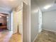 Hallway with tile flooring, washer and dryer closet, and built-in storage cabinets at 3599 Caruso Pl, Oviedo, FL 32765