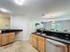 Well-appointed kitchen featuring stainless steel appliances, granite countertops, and an open view of the living area at 3599 Caruso Pl, Oviedo, FL 32765