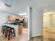Modern kitchen with stainless steel appliances, granite countertops, and a breakfast bar with stools at 3599 Caruso Pl, Oviedo, FL 32765