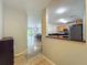 Open-concept living and dining area with tiled floors, sliding glass doors, and modern furnishings at 3599 Caruso Pl, Oviedo, FL 32765