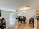 Bright living area with tiled floors, ceiling fan, and sliding doors leading to an outdoor space at 3599 Caruso Pl, Oviedo, FL 32765