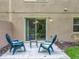 Charming patio with blue Adirondack chairs and outdoor space, perfect for relaxing and entertaining at 3599 Caruso Pl, Oviedo, FL 32765