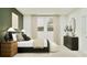 Elegant bedroom showcasing a comfortable bed, natural light, and stylish dresser at 373 Sol Vista Dr, Dundee, FL 33838