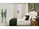 Modern bedroom with neutral tones, a large bed and stylish bedside lamps at 373 Sol Vista Dr, Dundee, FL 33838