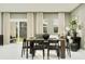 Inviting dining area featuring a modern table, stylish chairs, and bright natural light at 373 Sol Vista Dr, Dundee, FL 33838