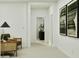 Inviting hallway featuring a cozy chair and views into other rooms of the home at 373 Sol Vista Dr, Dundee, FL 33838
