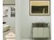 Bright hallway with a laundry cart and a view into an adjacent living area at 373 Sol Vista Dr, Dundee, FL 33838