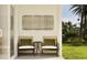 Inviting patio space with stylish seating and serene outdoor view, perfect for relaxation at 373 Sol Vista Dr, Dundee, FL 33838