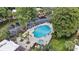 This aerial view shows the pool, parking lot, gazebo and lush landscaping at 3997 Versailles Dr # 3997F, Orlando, FL 32808