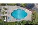 The aerial view shows a pool surrounded by patio and landscaping at 3997 Versailles Dr # 3997F, Orlando, FL 32808