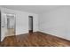 Spacious bedroom featuring wood-look floors and ample closet space at 3997 Versailles Dr # 3997F, Orlando, FL 32808