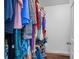 A walk-in closet with ample hanging space and wood floor at 3997 Versailles Dr # 3997F, Orlando, FL 32808