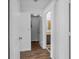 Hallway view showcasing doors leading to a closet and a bathroom at 3997 Versailles Dr # 3997F, Orlando, FL 32808