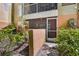 This screened-in patio is surrounded by lush plants at 3997 Versailles Dr # 3997F, Orlando, FL 32808