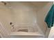 Close up of white soaking tub with jets, silver hardware and blue towel at 4002 San Gallo Dr # 105, Kissimmee, FL 34741