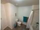 Bathroom with toilet, shower and tub combination, and blue accent wall at 4002 San Gallo Dr # 105, Kissimmee, FL 34741