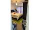 Bright bedroom featuring a bed with a red heart pillow and a green rug at 4002 San Gallo Dr # 105, Kissimmee, FL 34741