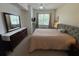 Well-lit bedroom with a comfortable bed, dresser, and closet for storage, creating a relaxing retreat at 4002 San Gallo Dr # 105, Kissimmee, FL 34741