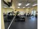 Community gym with modern treadmills, elliptical machines, weights, and mirrored walls at 4002 San Gallo Dr # 105, Kissimmee, FL 34741
